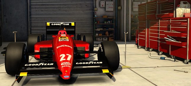 F1 2013 Ferrari F1-87/88C waiting in the pits.